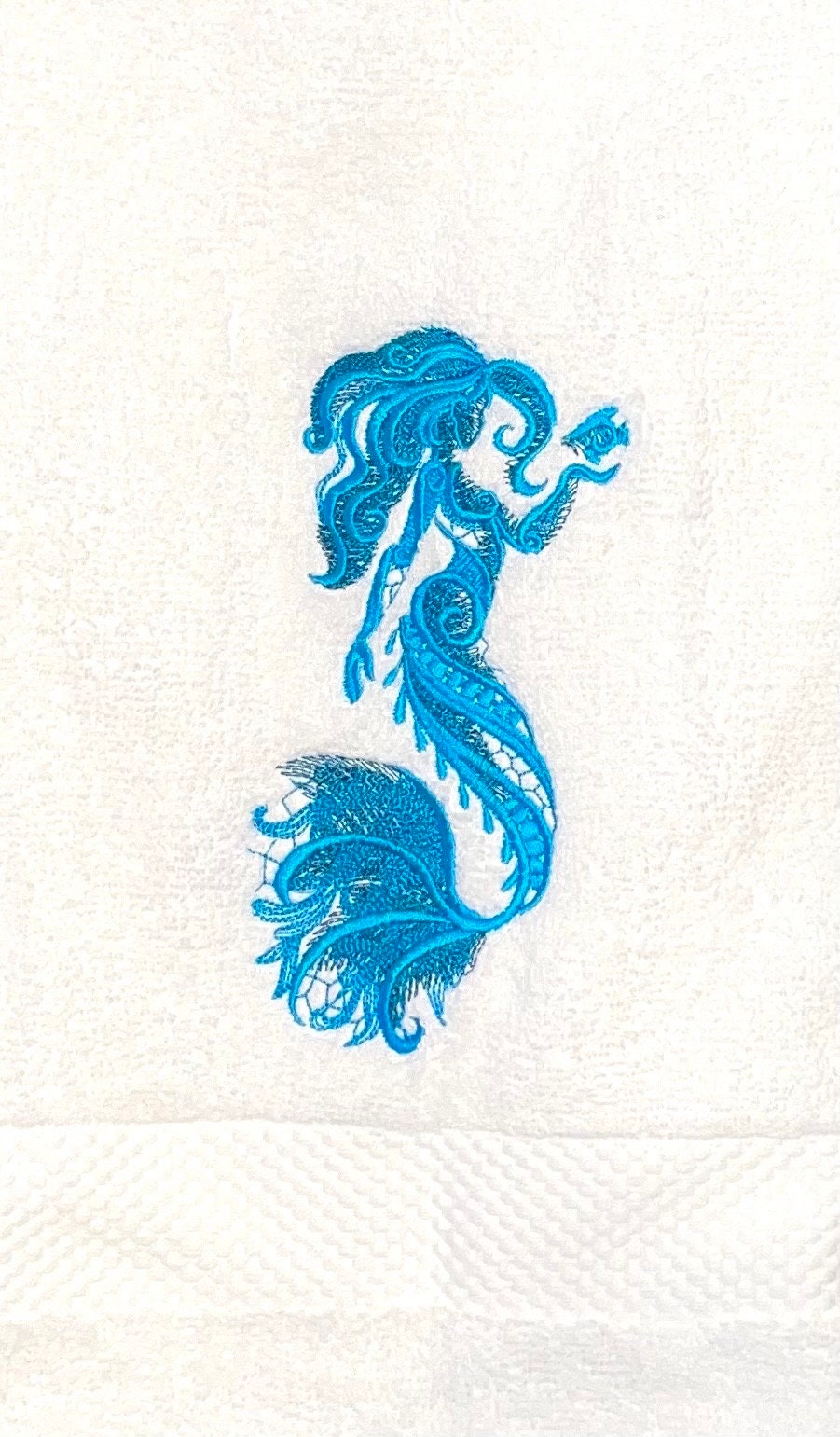 Embroidered Mermaid Hand Towel. Gorgeous Mermaid embroidered in beautiful ocean colors. Add a touch of coastal luxury to any bathroom.